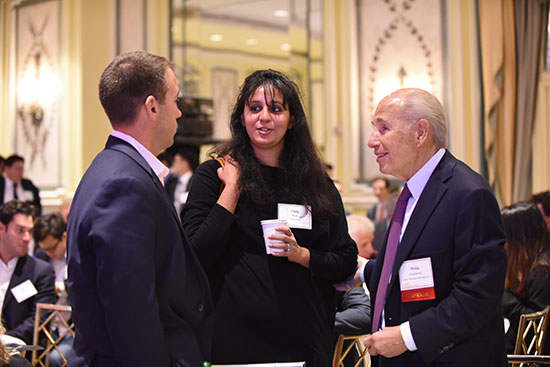 Members of the Cornell Real Estate Club at a social gathering