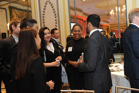 Members of the Cornell Real Estate Club at a social gathering